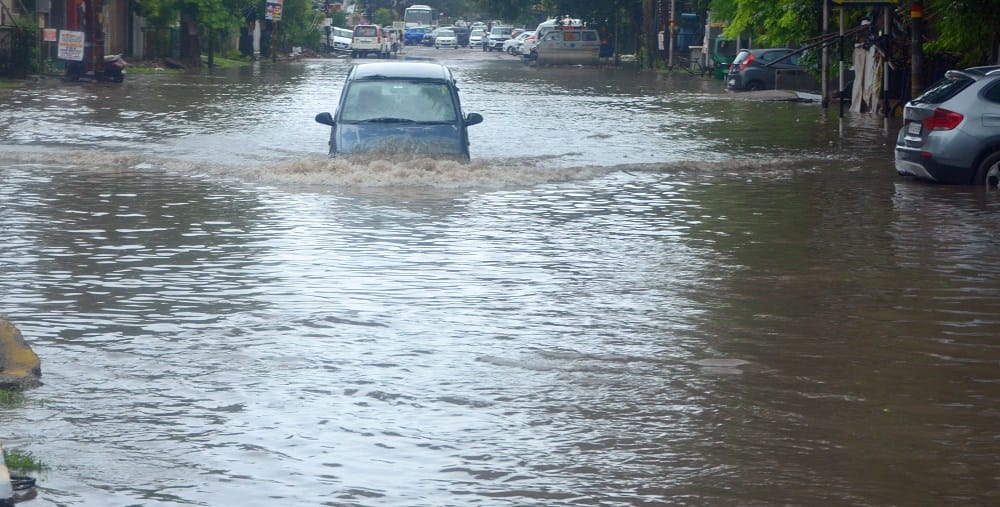Kanpur Life fueled by water 55 year rainfall record broken drains and roads overflowing water enters homes