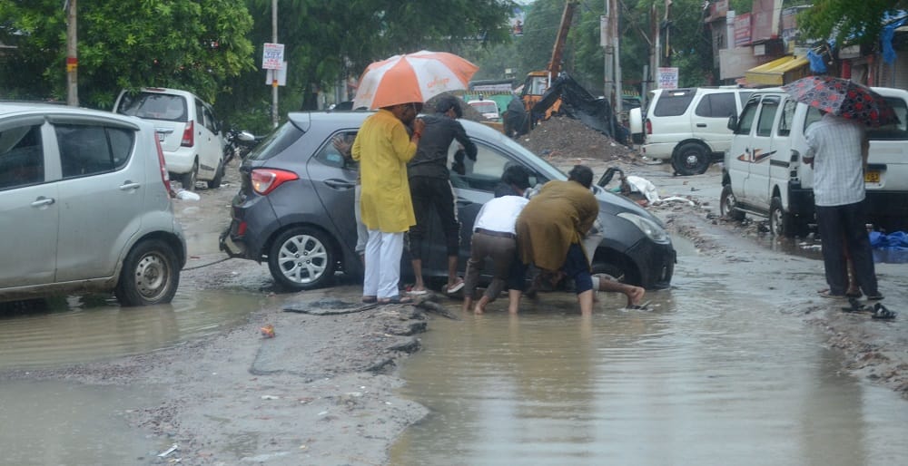 Kanpur Life fueled by water 55 year rainfall record broken drains and roads overflowing water enters homes