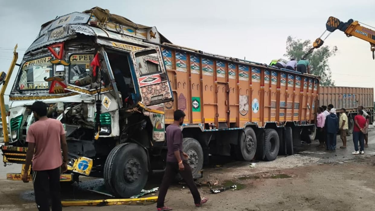 Massive collision involving three trucks national highway leaves three injured driver trapped cabin rescued