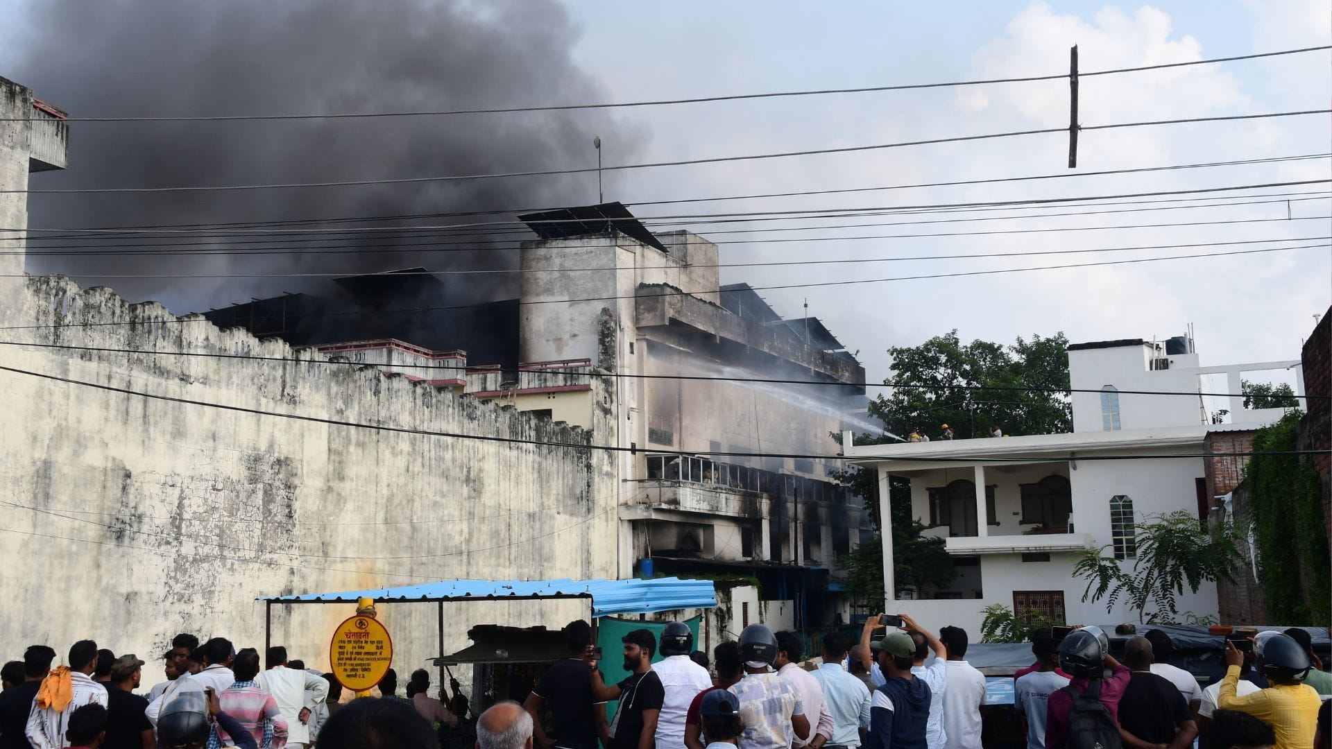 Varanasi fire news update Panic in hospital following massive fire at fan factory warehouse