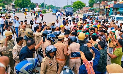 Uproar farmer leaders Petrol poured self police snatched lighter 14 people released after questioning