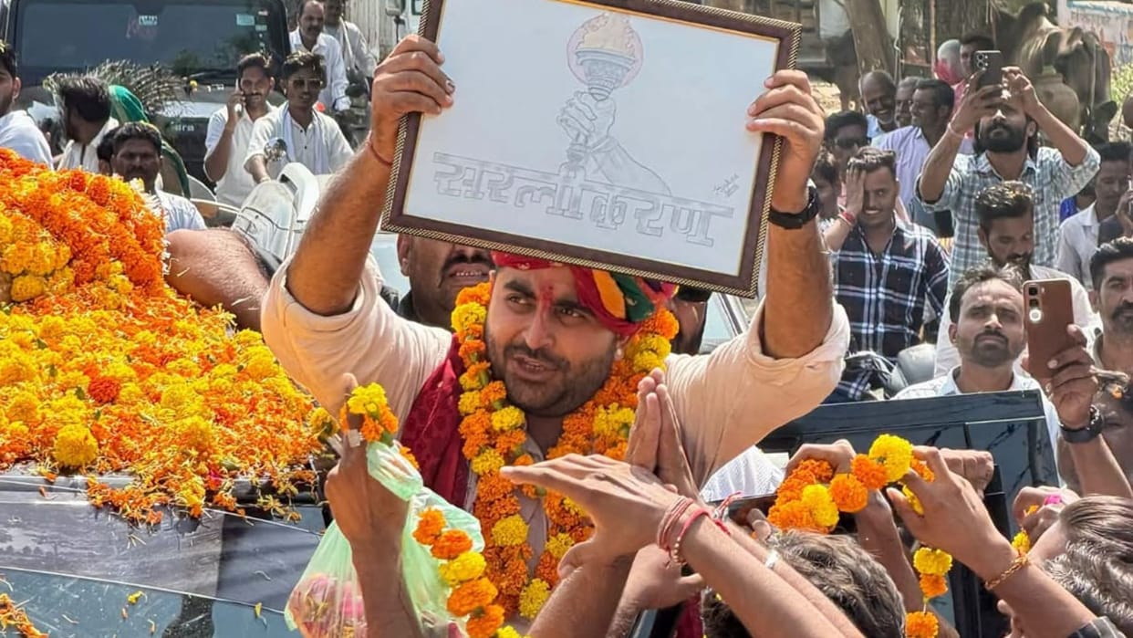EWS Simplification Yatra Reaches Jodhpur Ravindra Bhati Showered with Flower Petals via JCB