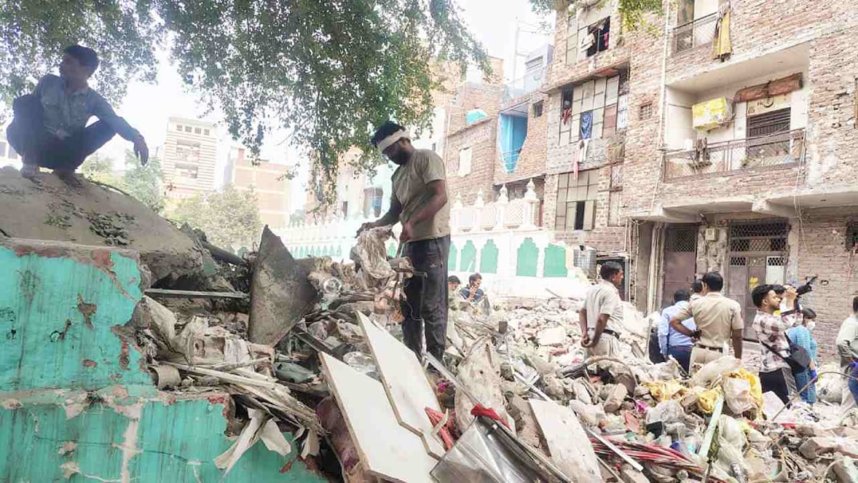 Delhi Seemapuri building collapse Helpless hands now sift through debris for remnants of their home