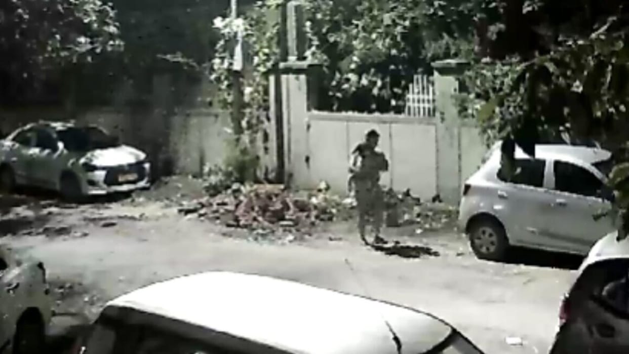 greater noida man throws plastic bag garbage on road cctv camera speaker warns of challan video goes viral