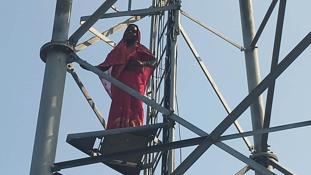 Woman climbs tower upset over daughter not being found