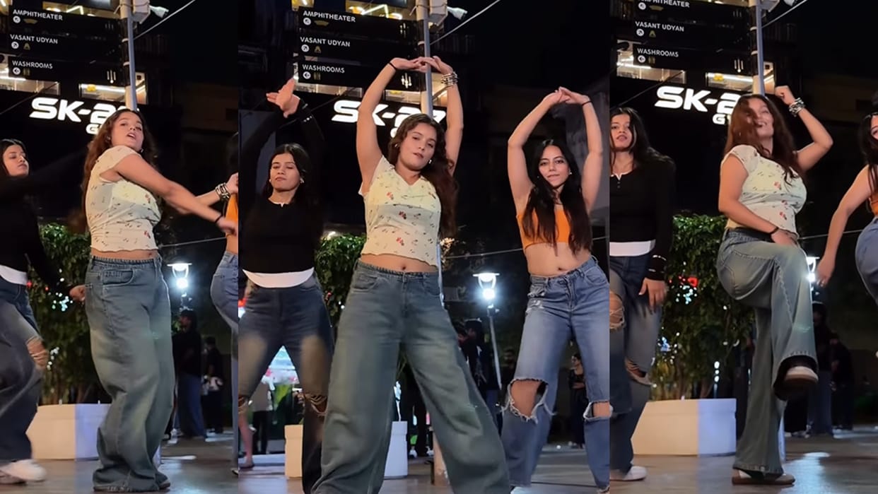 three girls danced in the middle of the road their moves were amazing people kept looking back