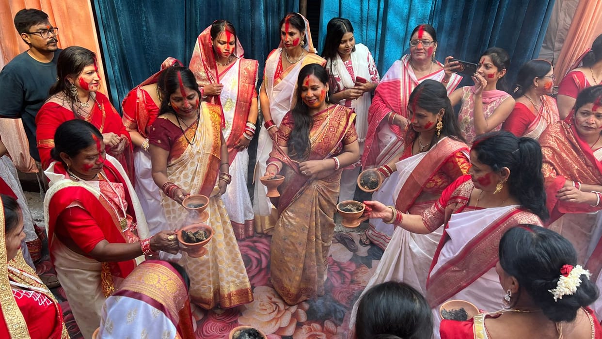 58 idols immersed amid Sindoor Khela and Dhunuchi dance Tamsa riverbank resounds with cheers eyes moist