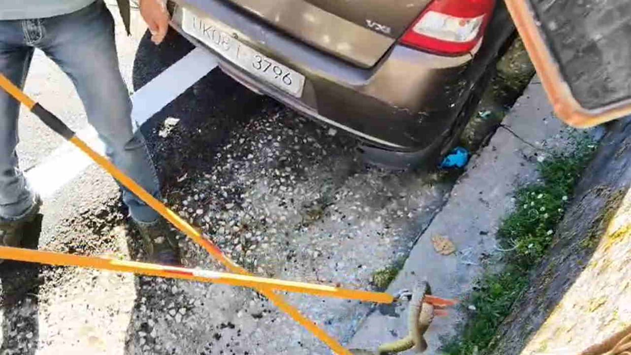 Snake enters car in new tehri residential colony forest department staff rescue
