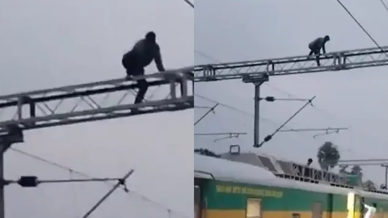 Wife Refuses to Talk Man Climbs Railway Electric Pole in Telangana