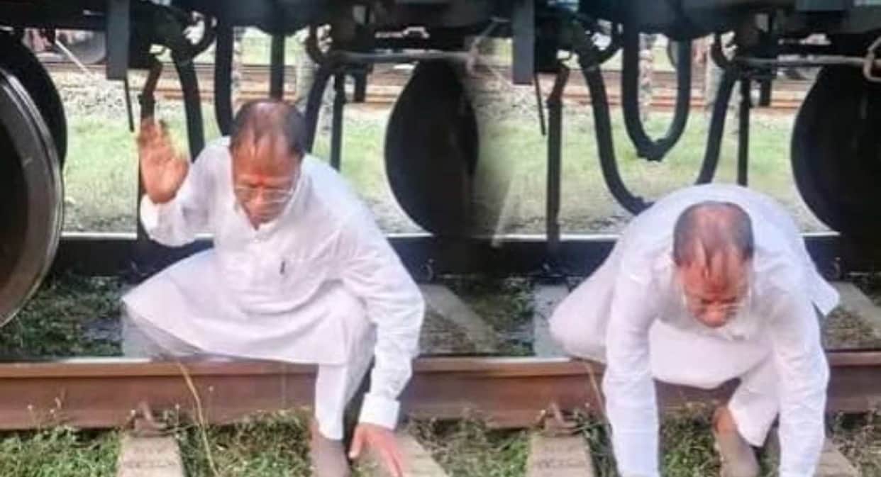 janki prasad yadav viral photo crawls under freight train koderma railway underpass demand