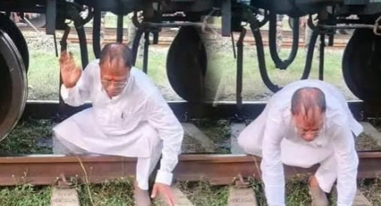 janki prasad yadav viral photo crawls under freight train koderma railway underpass demand