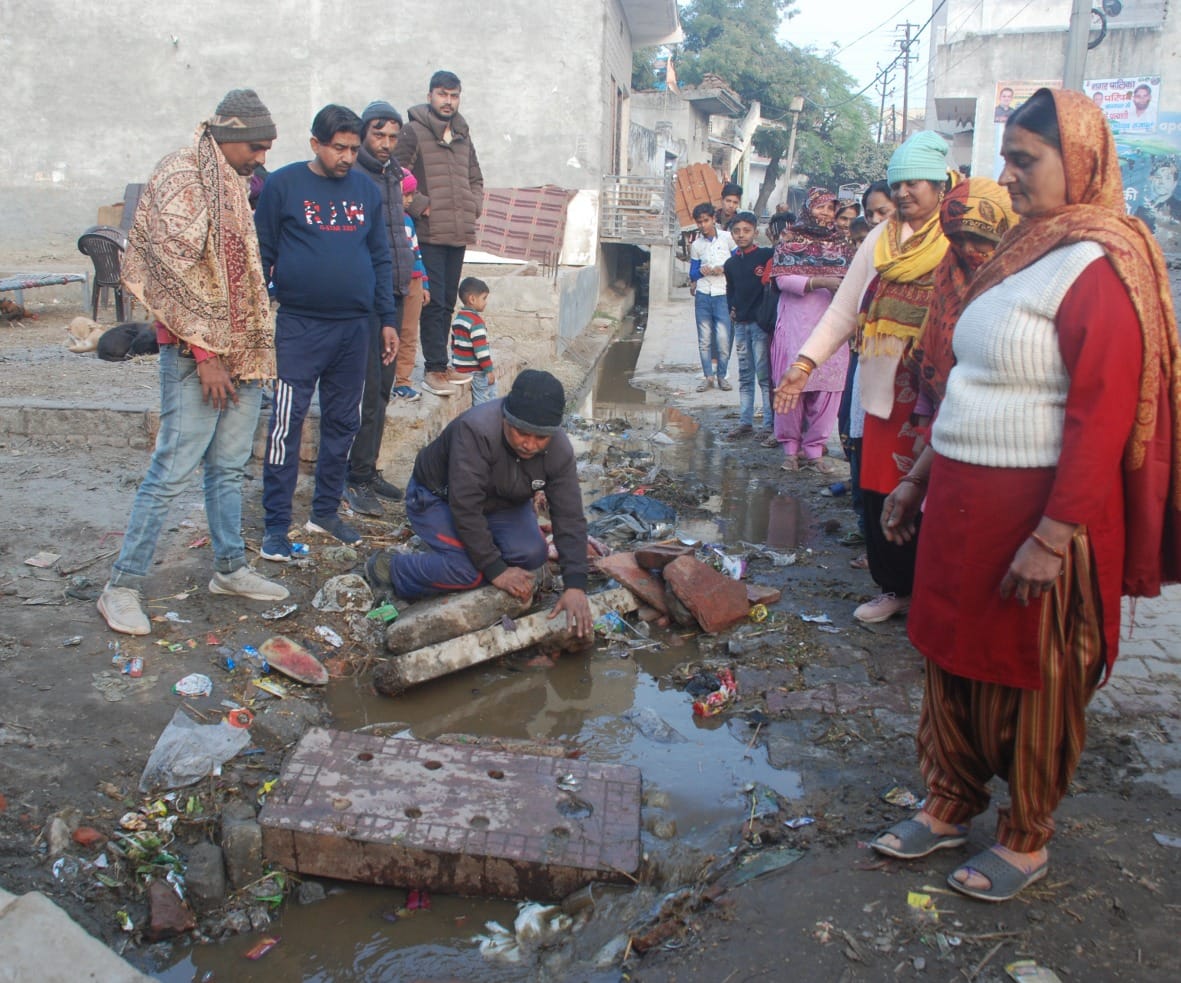Contaminated water in the street due to blocking drain