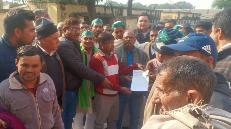 Holding four executive officers hostage, staged a sit-in at the powerhouse