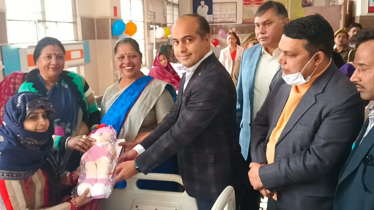 Girl's birth anniversary celebrated by cutting cake, presented gifts
