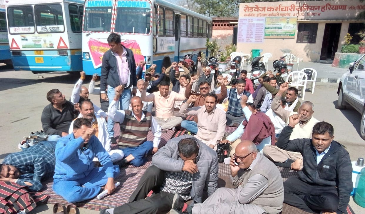 Roadways employees staged a sit-in at the bus stand