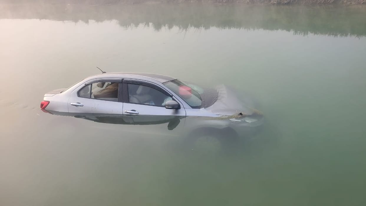 car dip in river