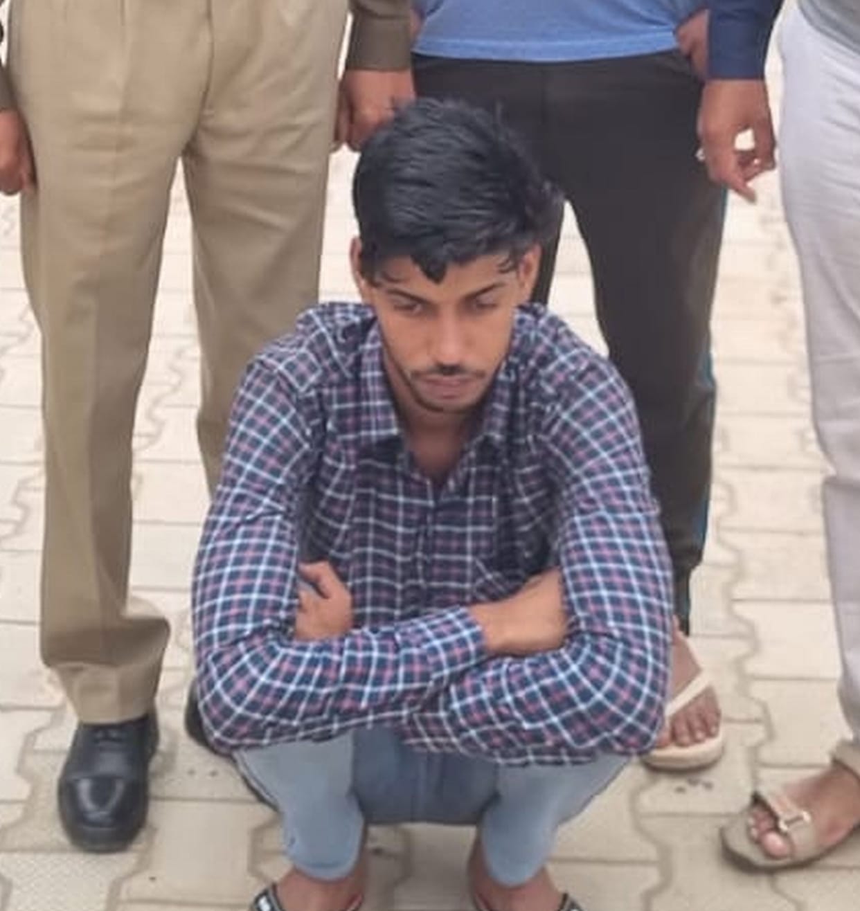 Accused of setting a person on fire by spraying petrol, arrested