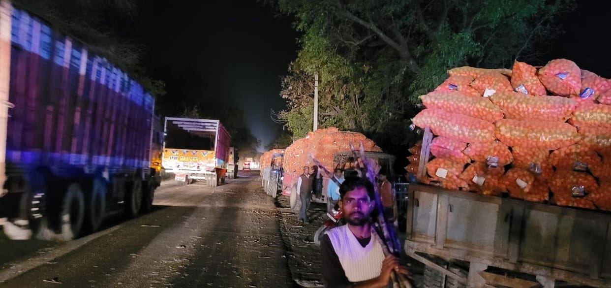Potato sacks got stuck in sugarcane laden trolley, jam on the highway