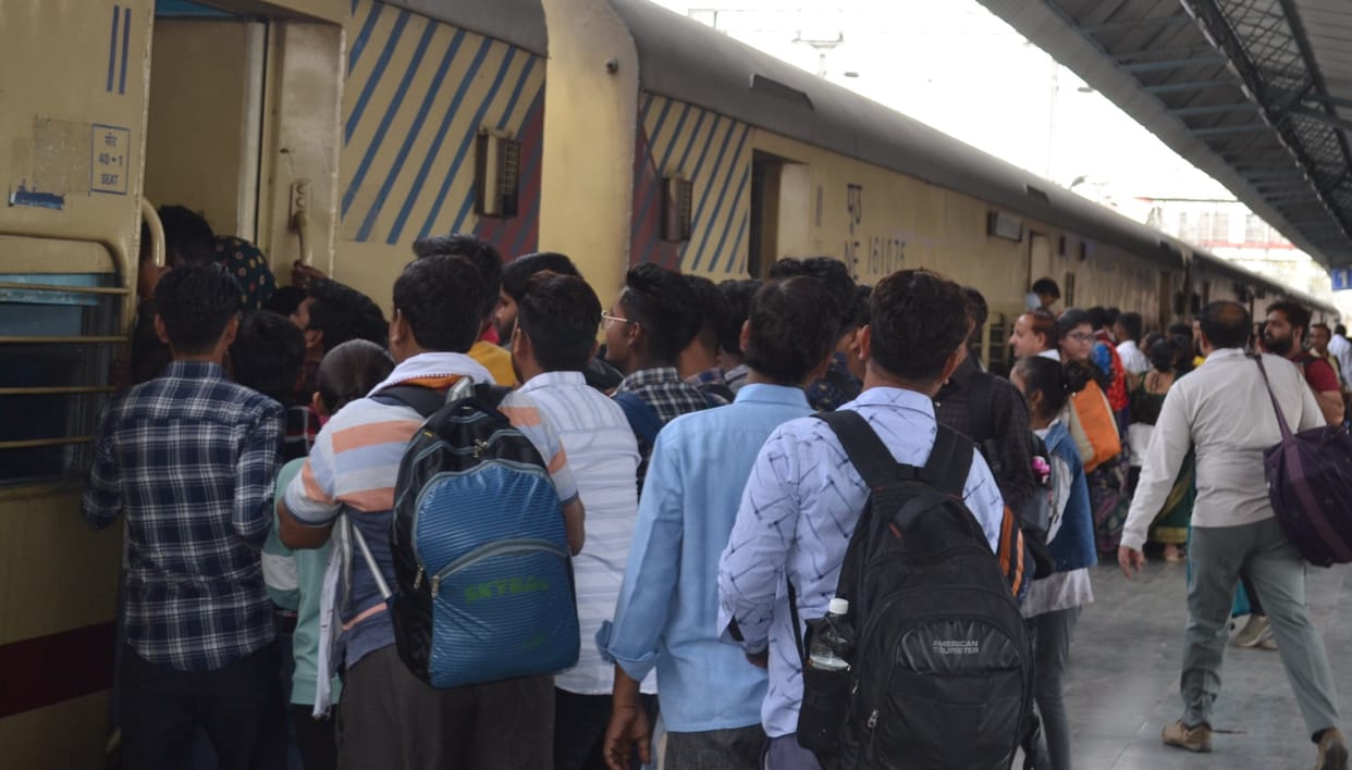 Crowds of returning in buses and trains
