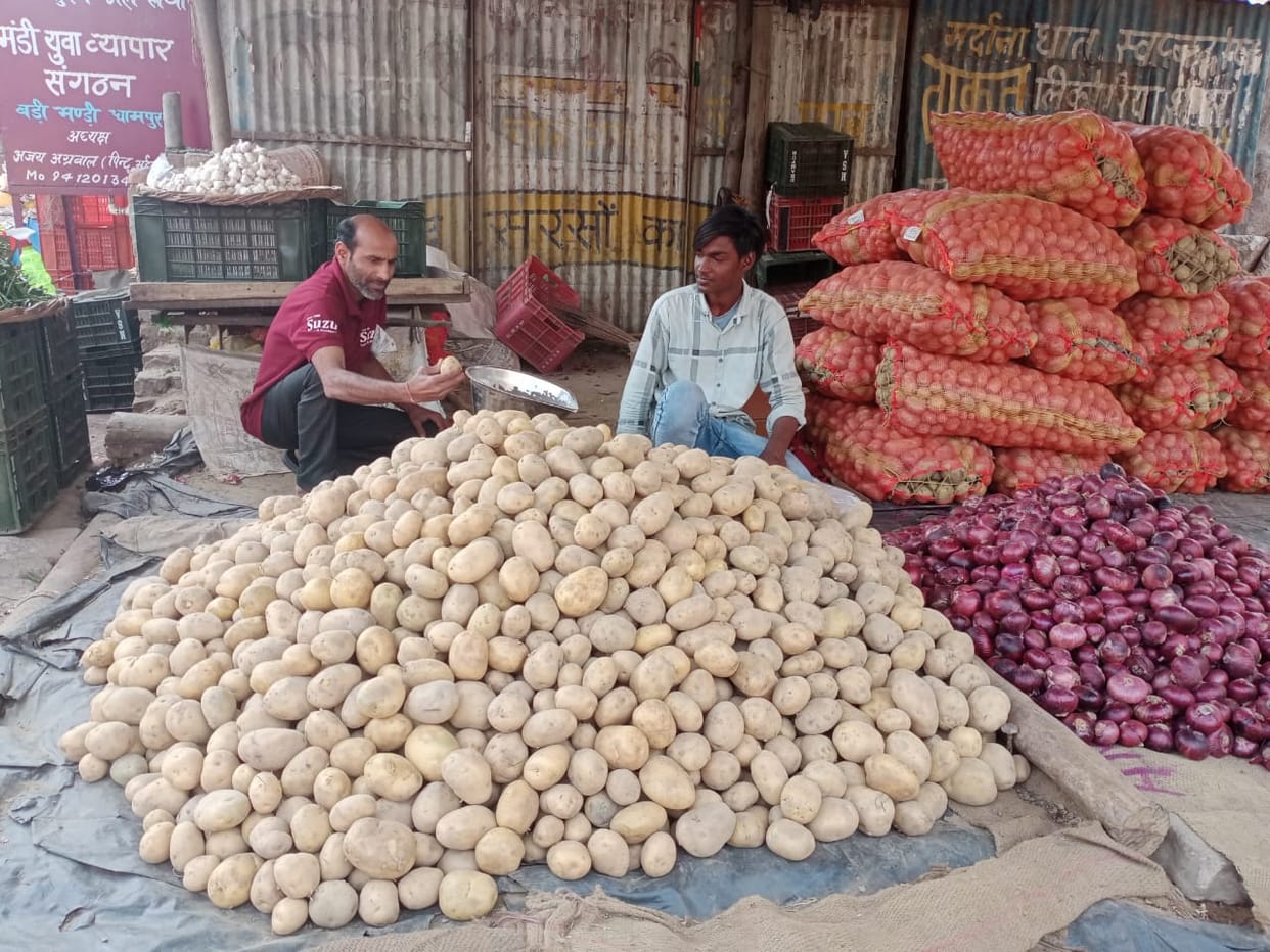 Production increased, prices fell, farmers selling potatoes from street to street to extract cost