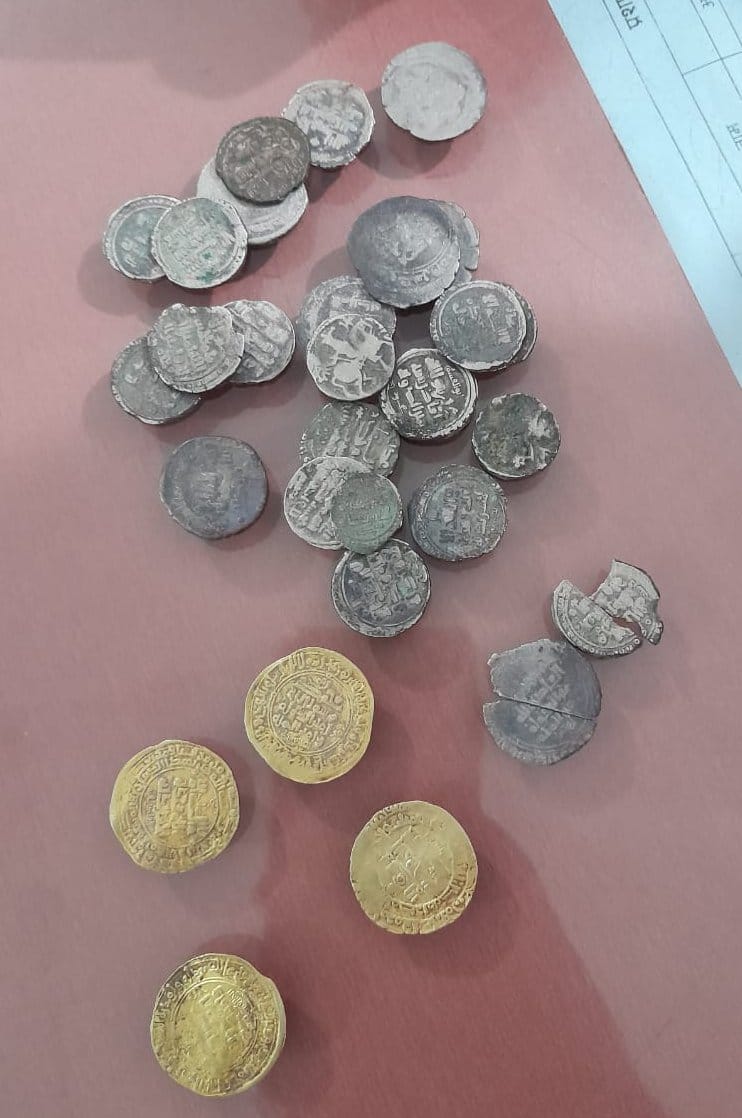 34 gold and silver coins recovered from the foundation digging