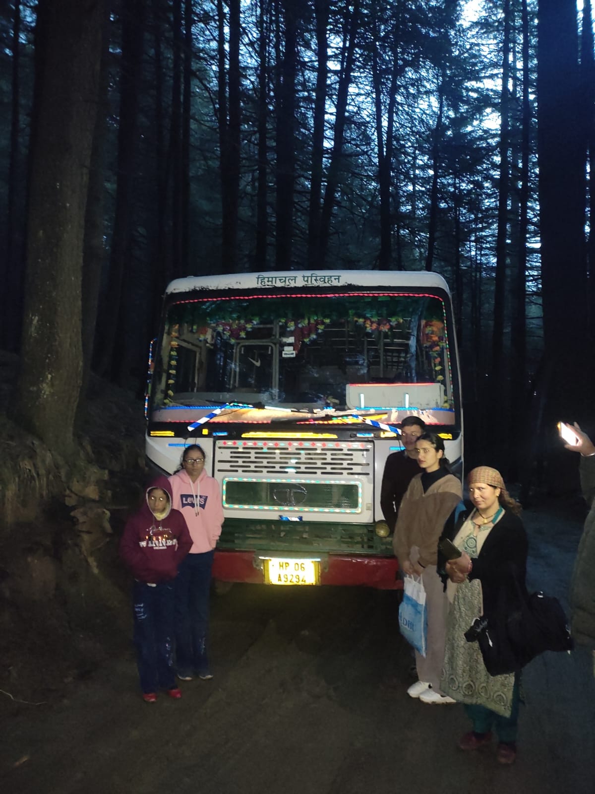 Bus parked in forest due to bad road, passengers upset