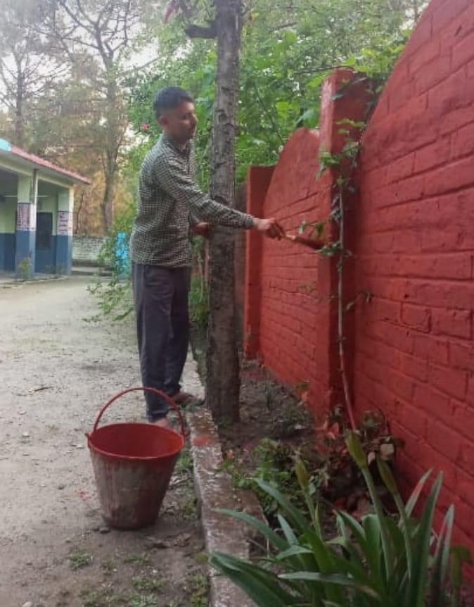 The teacher himself painted the walls and benches of the school