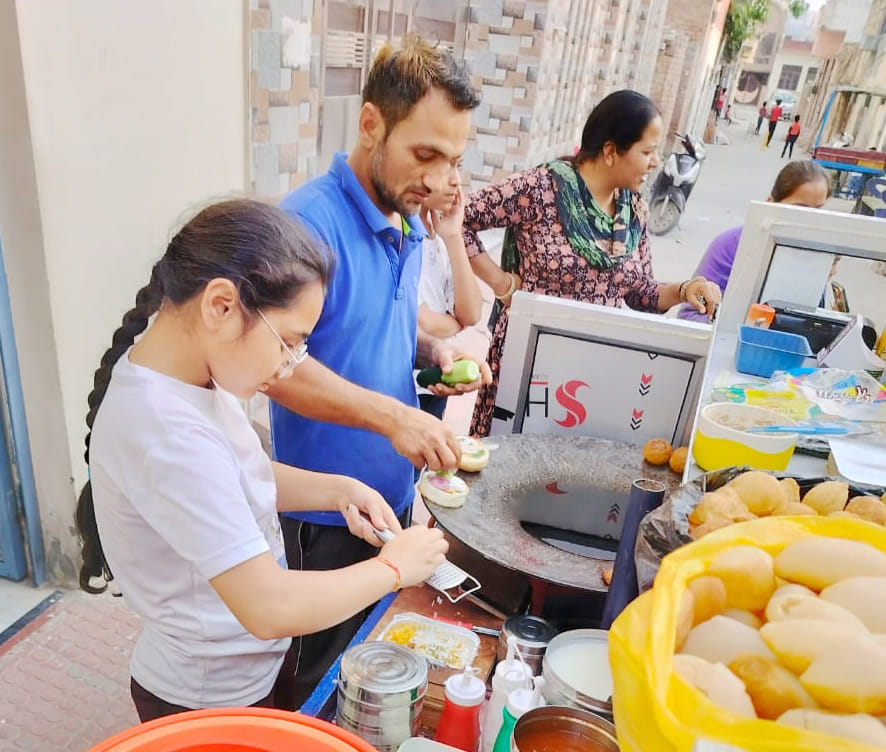 To raise money for kidney treatment, Anisha helps her father on street vendors