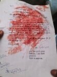 मोदीनगर। मृतक किसान सुशील कुमार का खून से सना प्रार्थना पत्र।