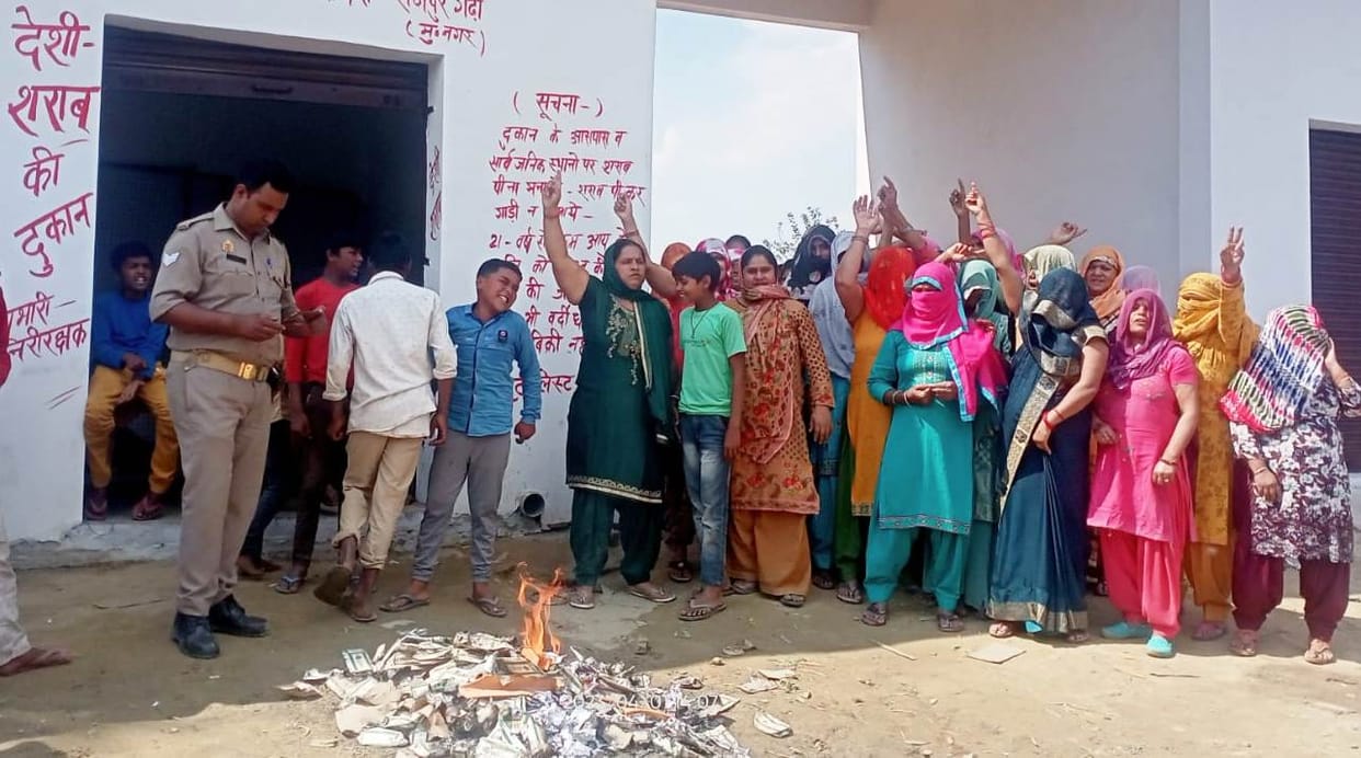 The women set fire to liquor pouches and bottles
