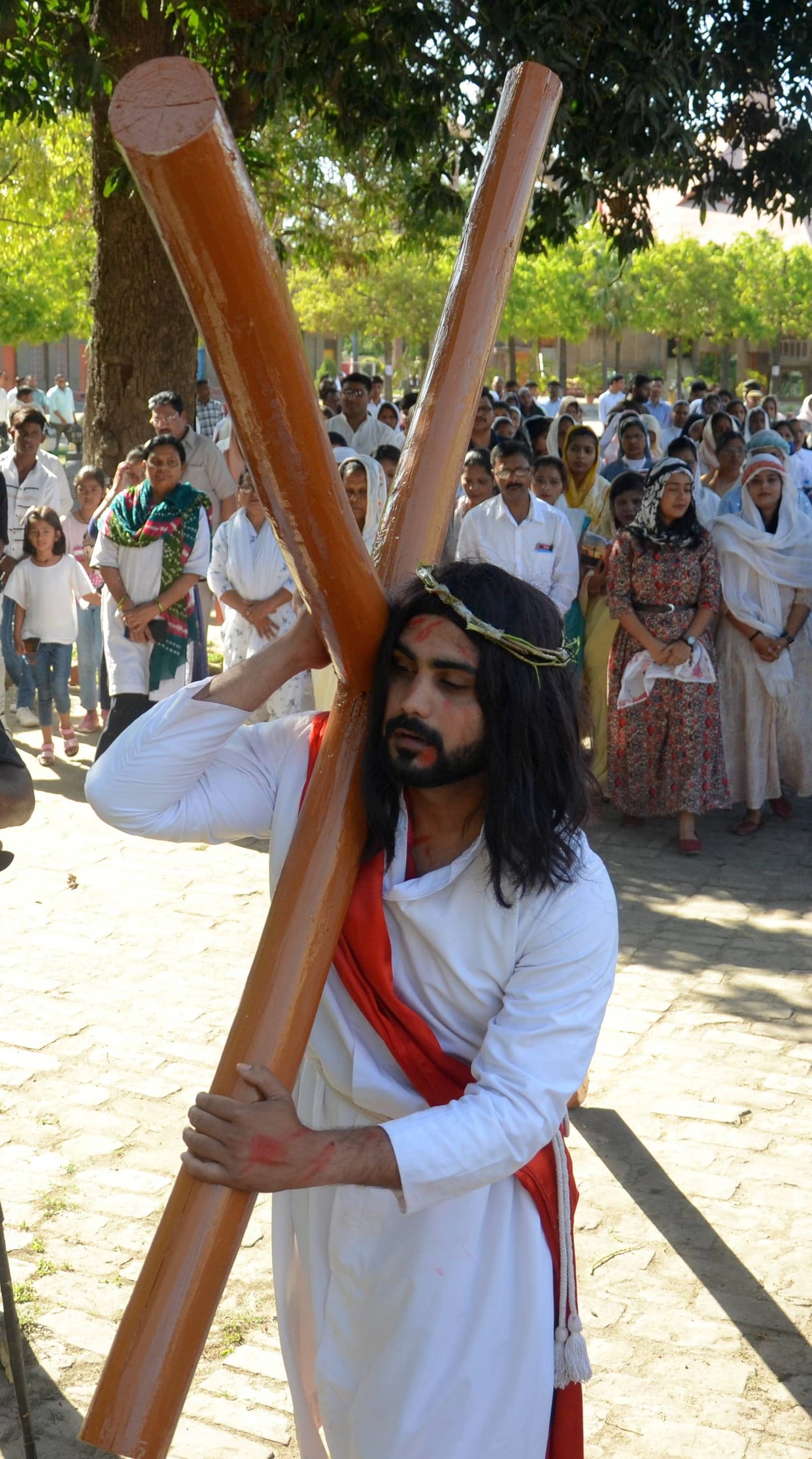 Devotees get emotional after watching the presentation of Jesus' crucifixion