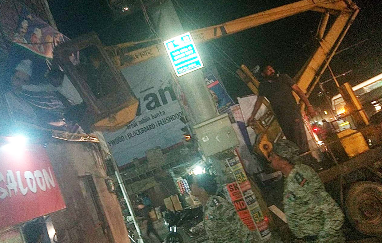 Publicity material being removed from city and village