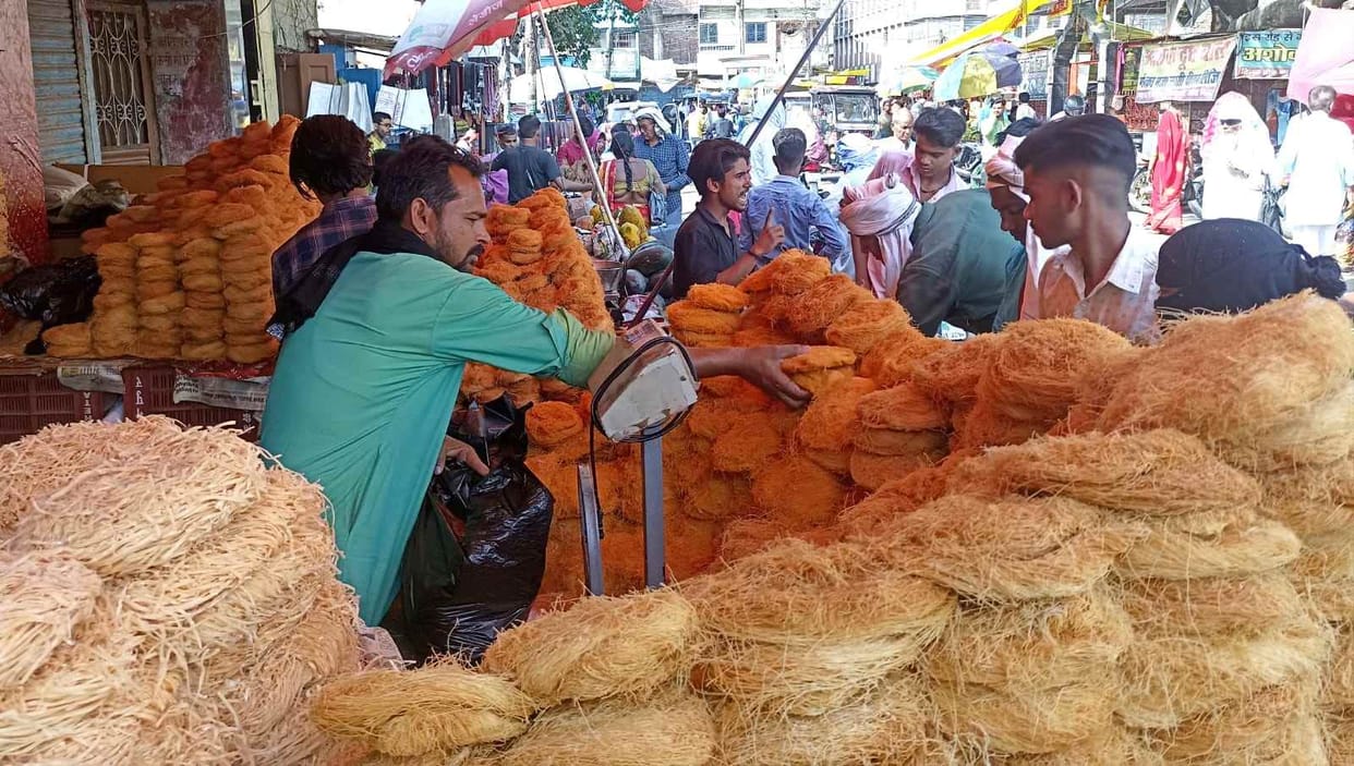 The market was buzzing, people made purchases