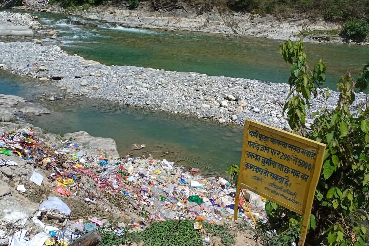 Garbage on river, road everywhere, municipality indifferent