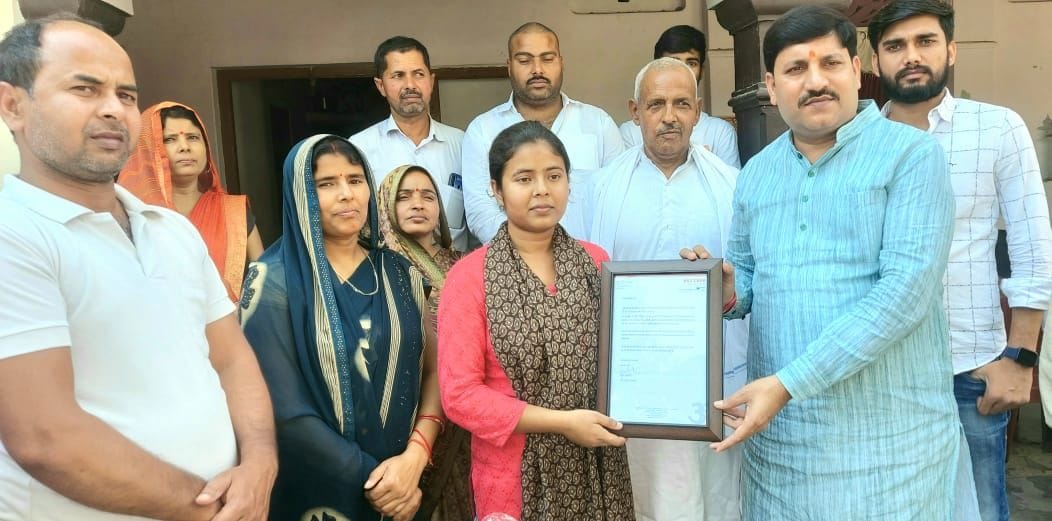 MLA cut cake with topper daughter, encouraged