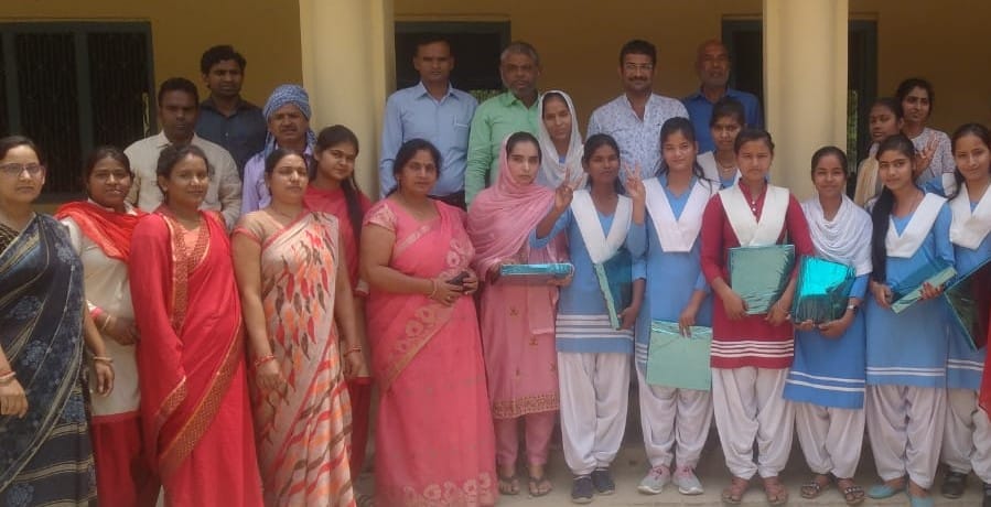 The manager honored the girl students who got good marks