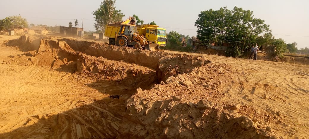 Earth's chest sieving with JCB