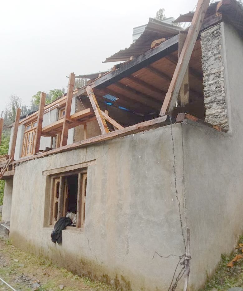 School and house roofs blown off in rain and darkness