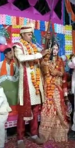 Video of bride and groom firing happily at wedding goes viral
