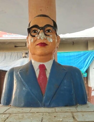Mentally retarded damaged Durga idol including Ambedkar statue