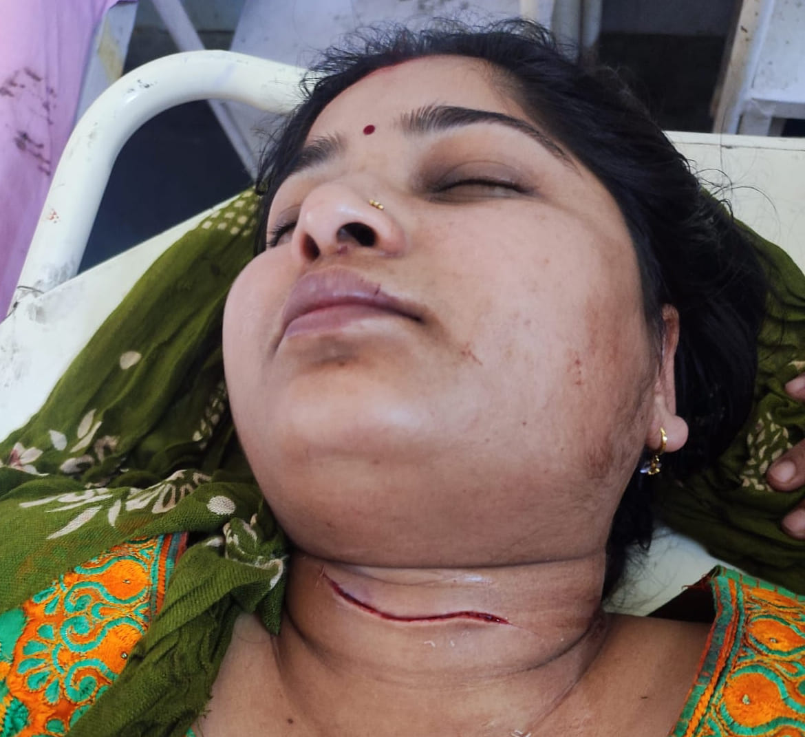 woman's throat slit after entering the house