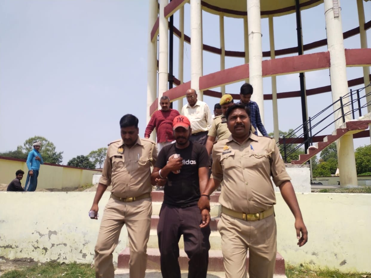 The young man climbed on the water tank