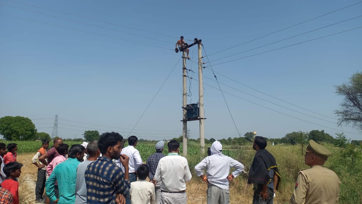 youth climbed on pole
