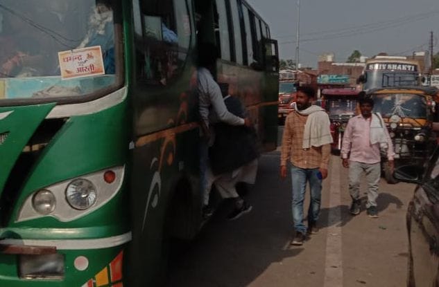 Private bus people taking ride in front of roadways bus, writing only responsible letters