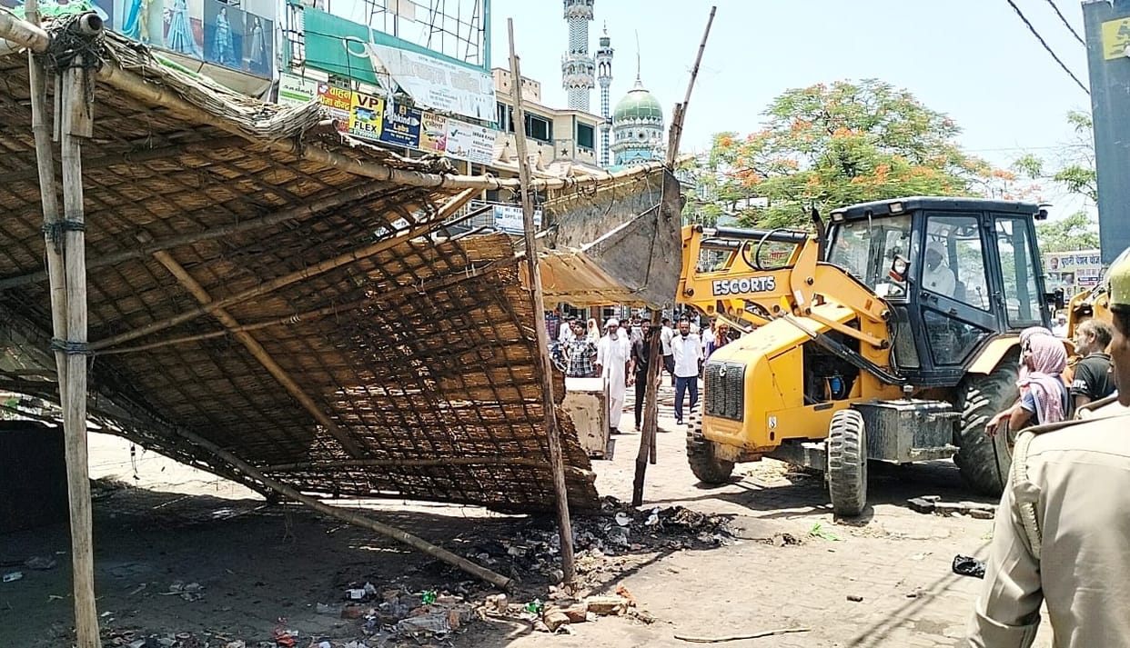 Bulldozer against encroachment, encroachment removed from road tracks