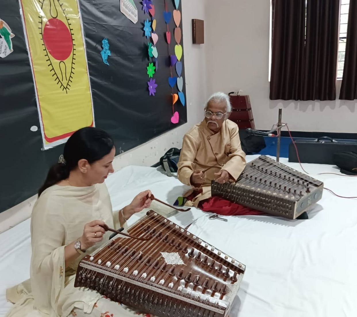 Pandit Tarun Bhattacharya teaches students to play santoor