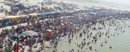 Devotees take a dip in the Ganges at Kachla Ghat