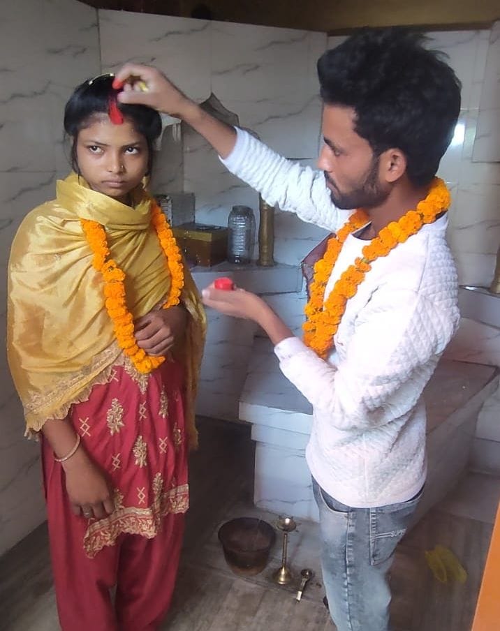 Social workers got the couple married in the temple