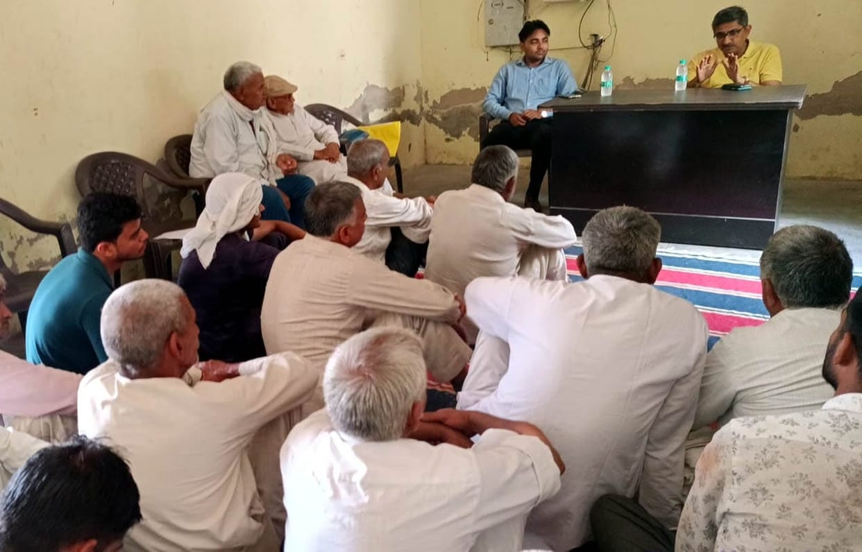 Information about horticulture scheme being given to the farmers in the camp