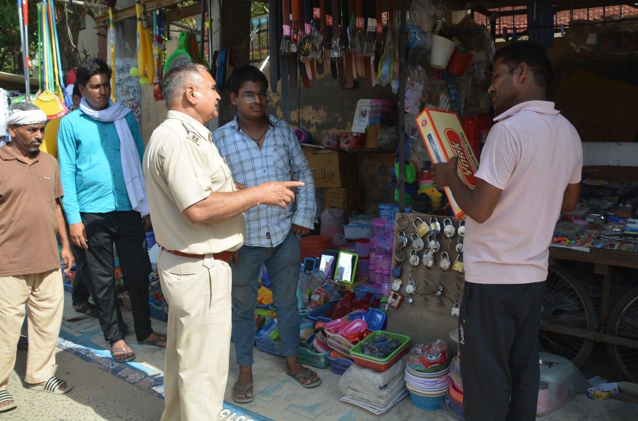 The hawkers were made 7 feet back from the yellow strip, warned to confiscate the goods next time